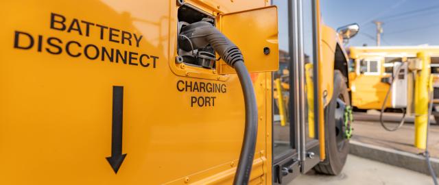 Charging port for a yellow electric school bus