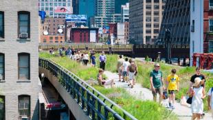 New York City highline with pedestrians and foliage