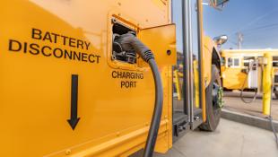 Charging port for a yellow electric school bus