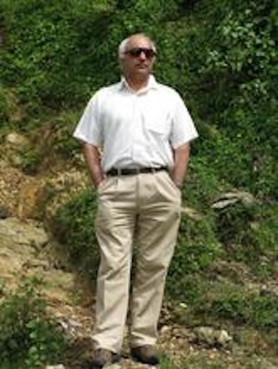 Kalyanakrishnan Sivaramakrishnan with foliage in the background