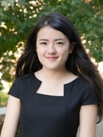 Headshot of Jiani Yang against a green forested backdrop.