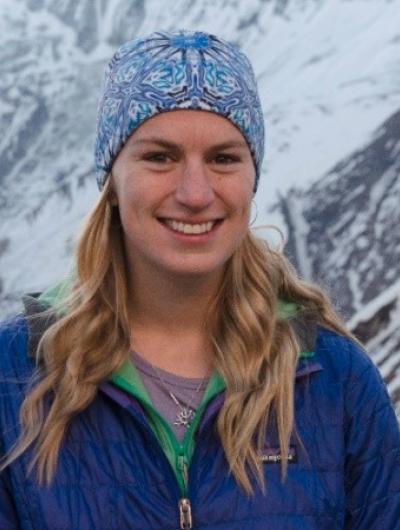 Headshot of Kelsey Semrod against a backdrop of snowy mountains.