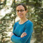 Headshot of Shannon LaDeau against stone wall background