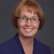 Headshot of Kristie Ebi in purple blazer