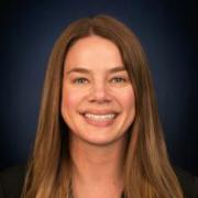 Headshot of Jenna Jorns against dark blue background