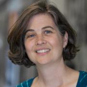 Headshot of Christina Rosan in striped shirt