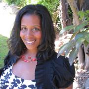 Headshot of Rue Mapp standing in garden