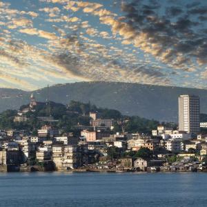 skyline of Freetown, Sierra Leone with harbor in foreground and cityscape in background